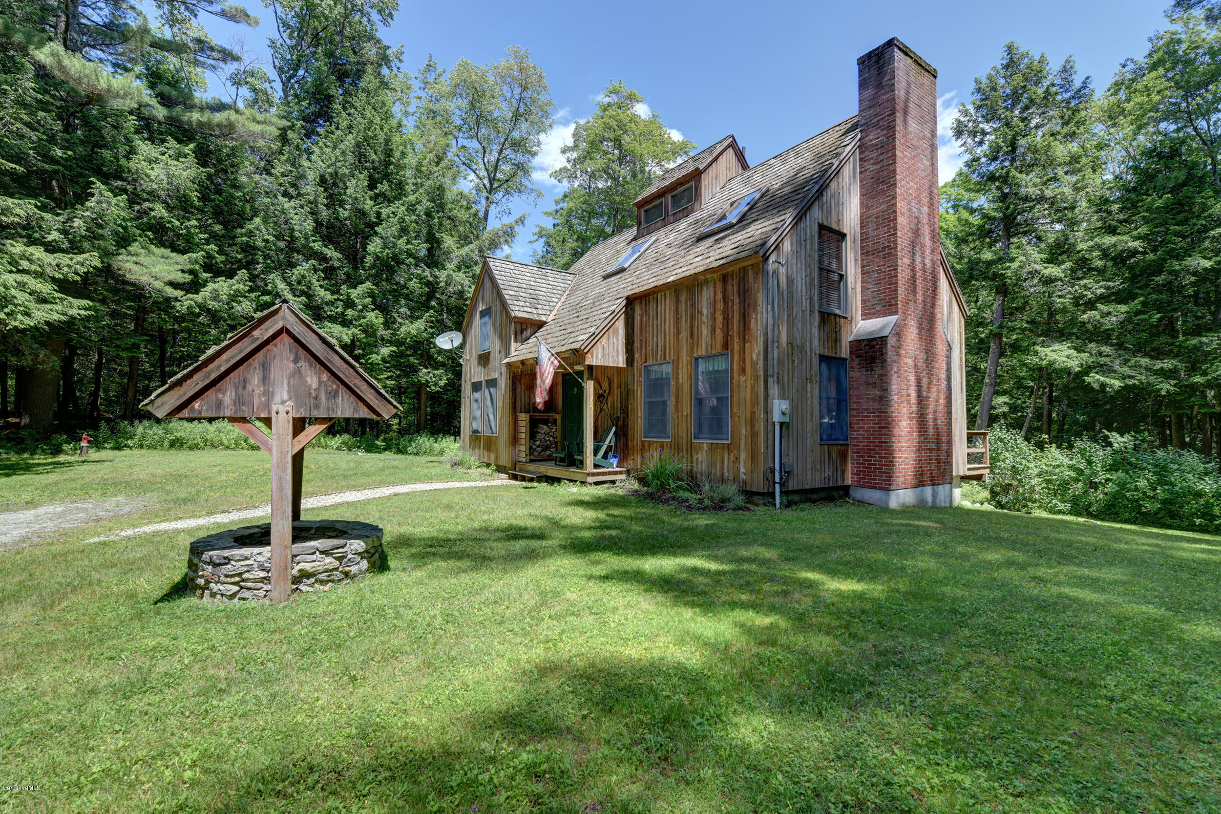 726 North Main Road Otis, MA 01253 - Photo 3 of 30 a house that has a tree in front of the house