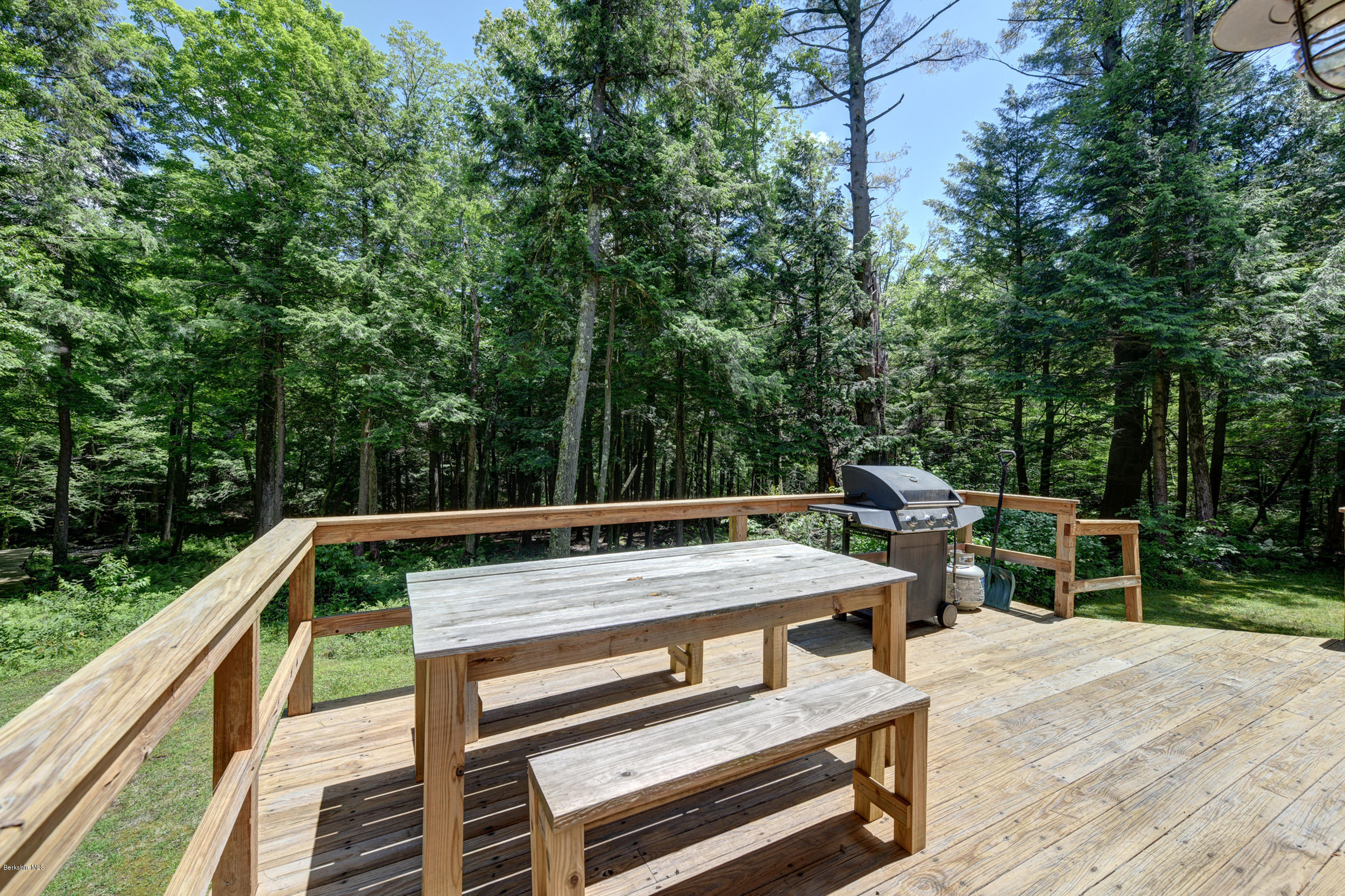726 North Main Road Otis, MA 01253 - Photo 23 of 30 a view of a wooden deck and a patio