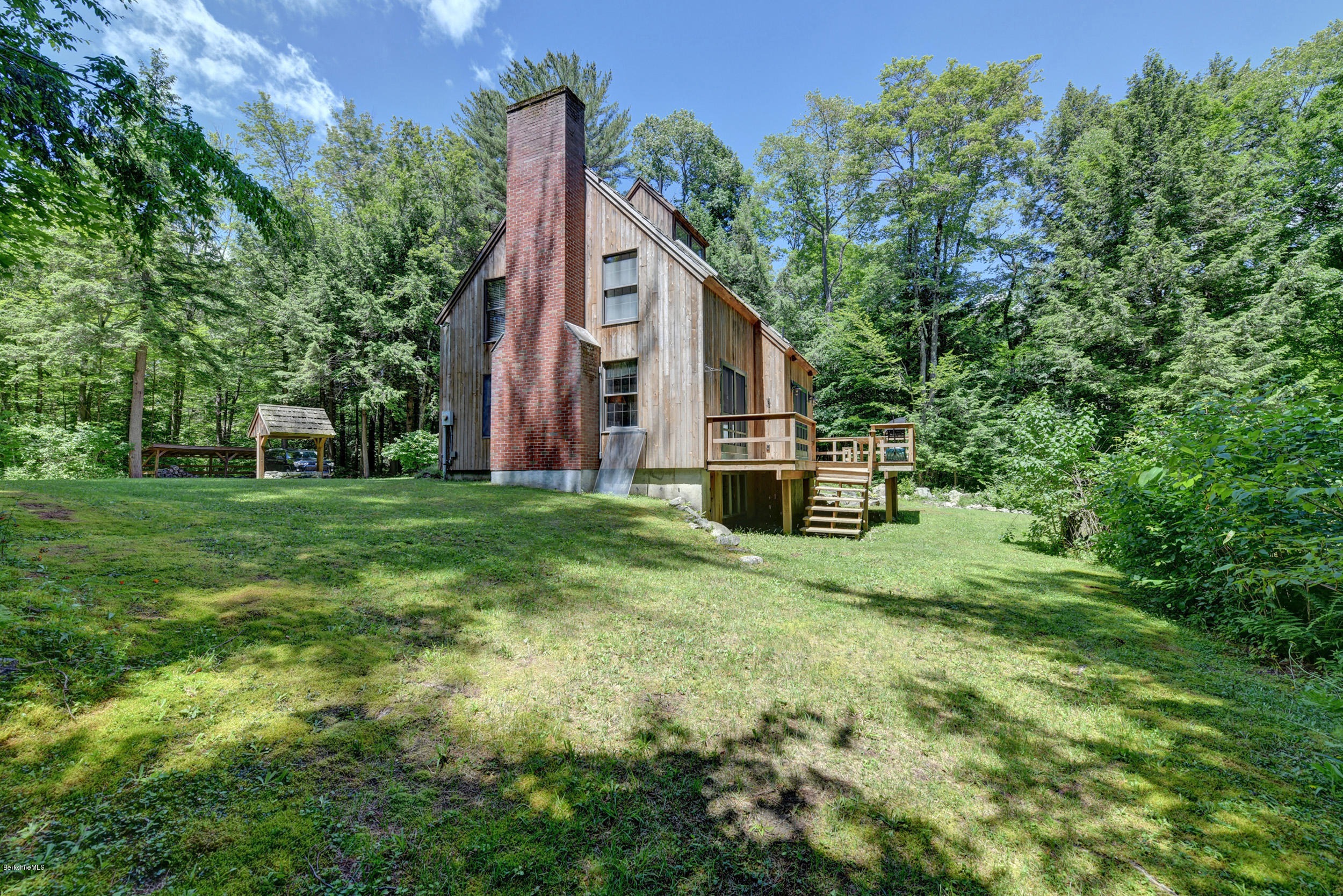 726 North Main Road Otis, MA 01253 - Photo 25 of 30 a view of a house with a yard