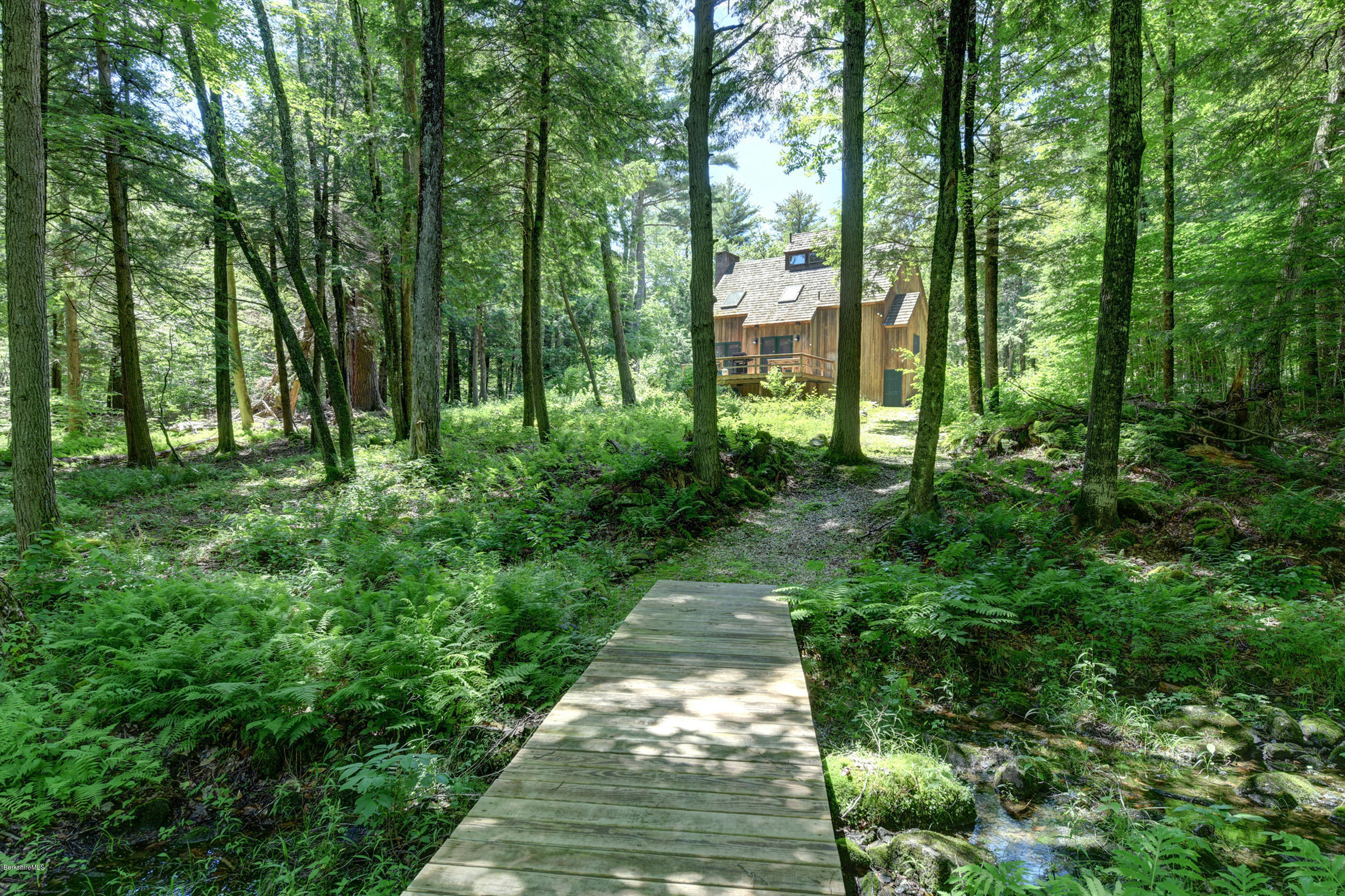 726 North Main Road Otis, MA 01253 - Photo 26 of 30 a backyard of a house with lots of green space