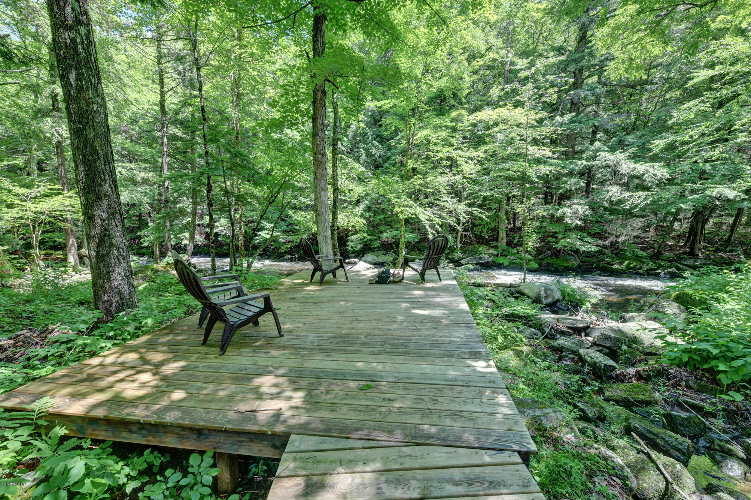 726 North Main Road Otis, MA 01253 - Photo 27 of 30 a view of a bench in a garden
