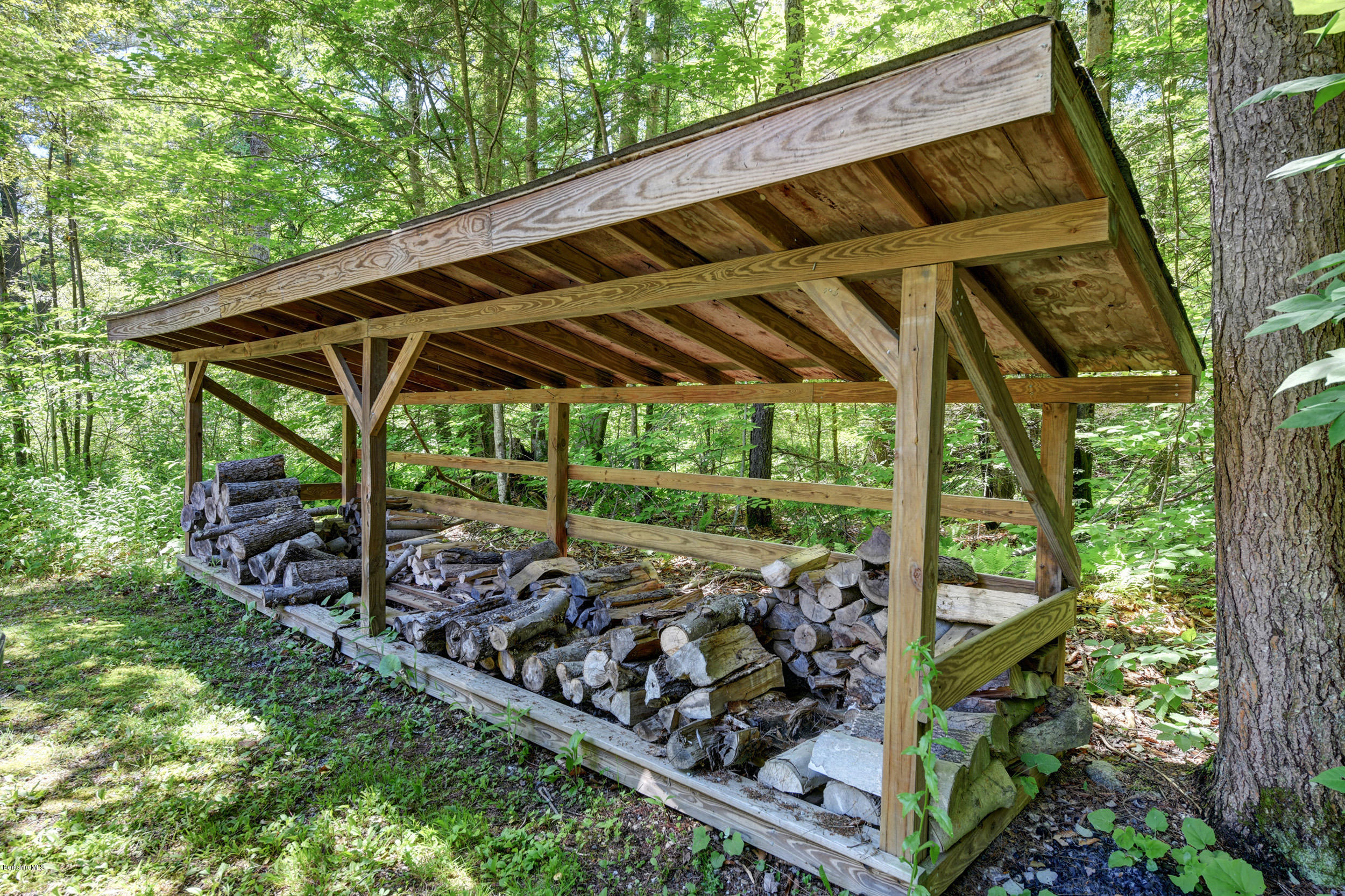 726 North Main Road Otis, MA 01253 - Photo 29 of 30 a view of a backyard with wooden floor and outdoor seating