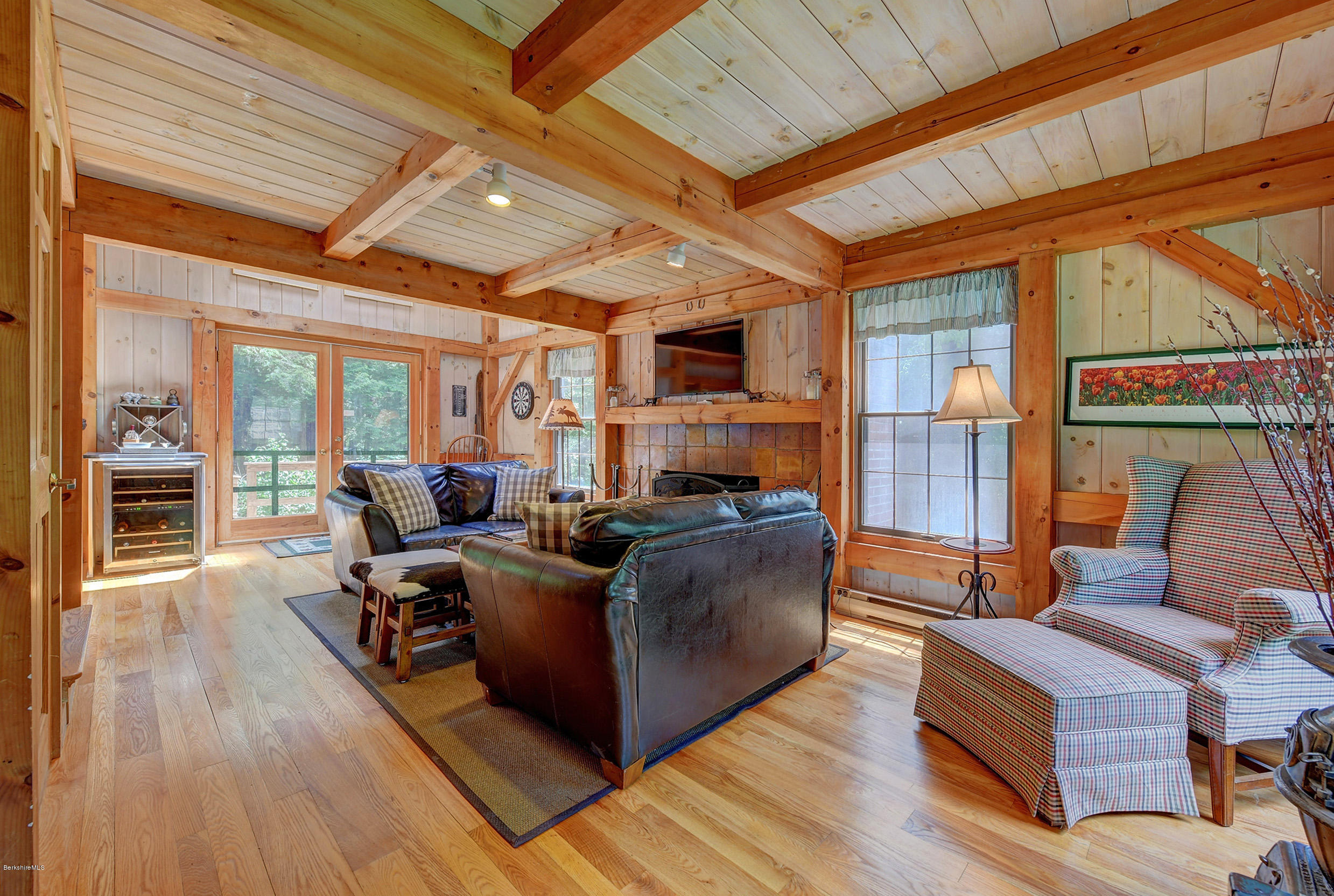 726 North Main Road Otis, MA 01253 - Photo 5 of 30 a living room with furniture a wooden floor and next to a window