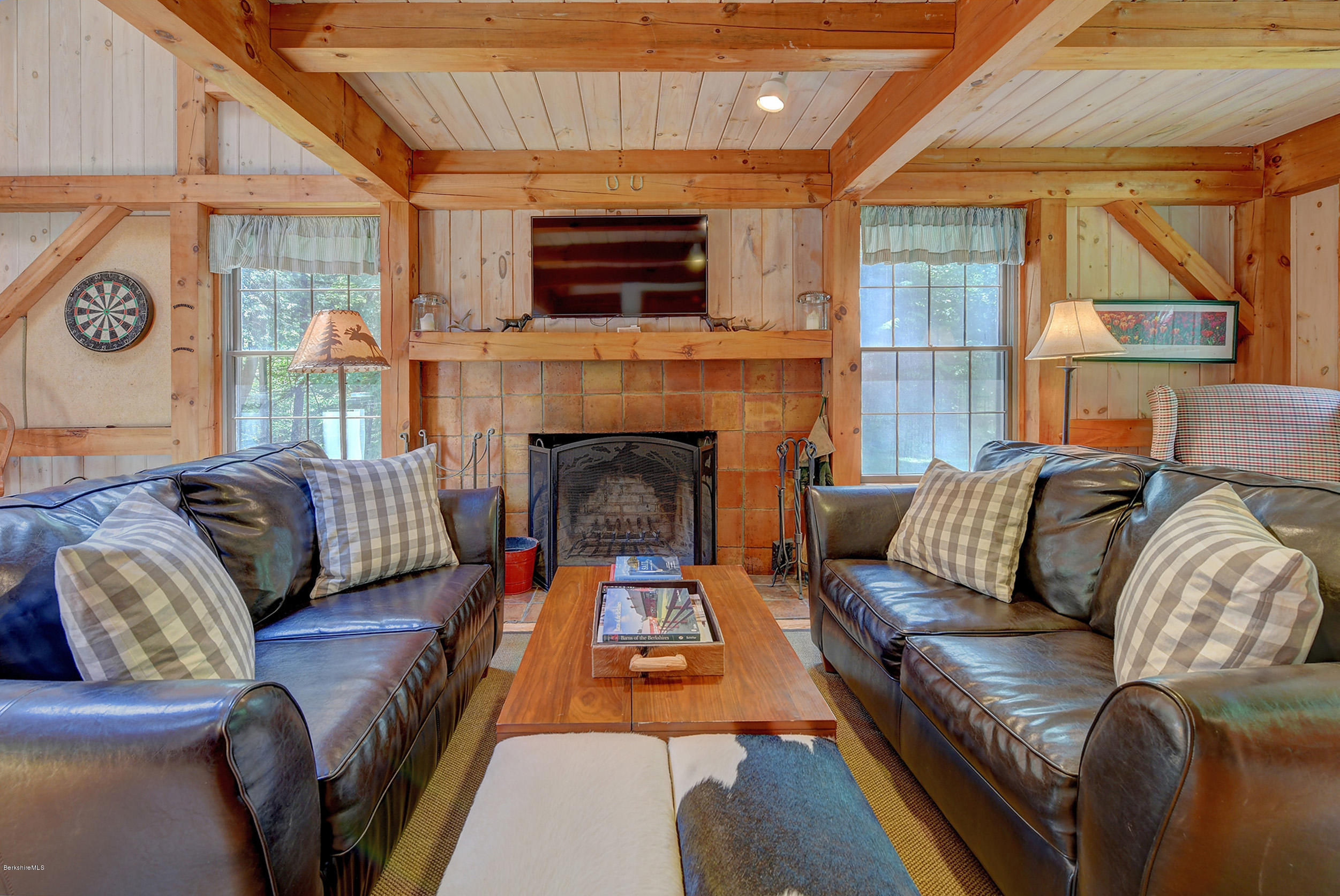726 North Main Road Otis, MA 01253 - Photo 6 of 30 a living room with furniture window and a fireplace