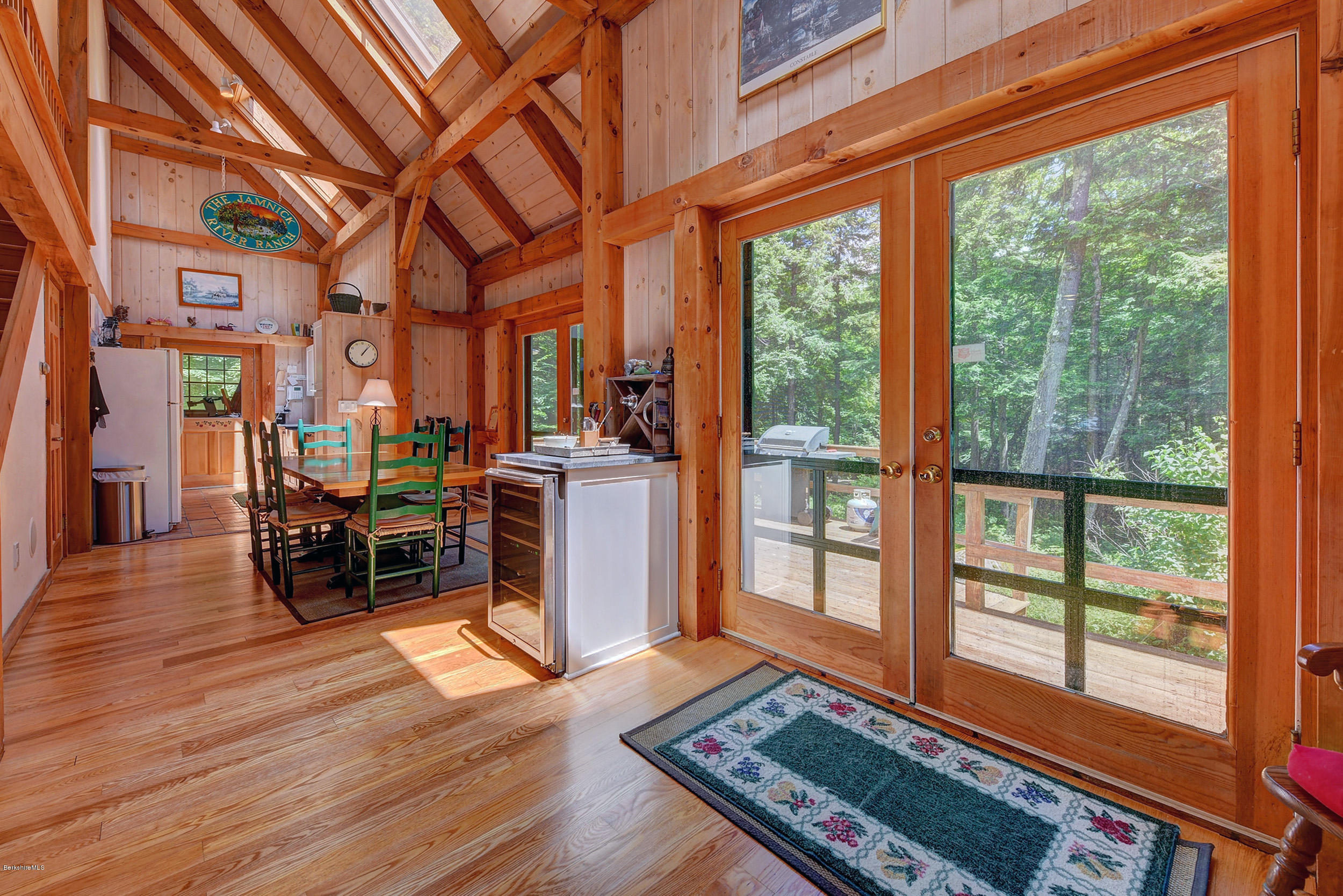 726 North Main Road Otis, MA 01253 - Photo 8 of 30 a living room filled with furniture and a table