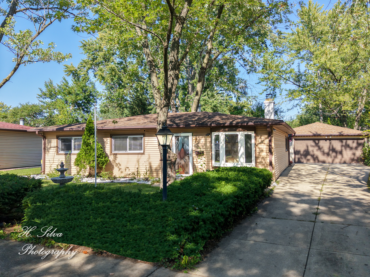 117 Marryat Place Streamwood, IL 60107 - Photo 1 of 15 a front view of a house with a yard and green space