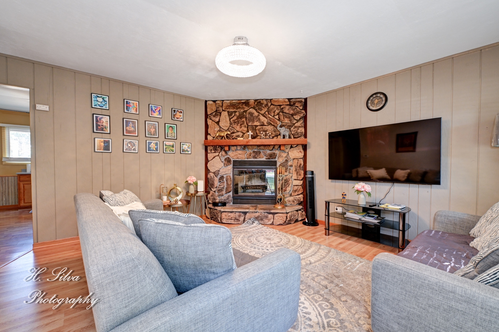 117 Marryat Place Streamwood, IL 60107 - Photo 2 of 15 a living room with furniture and a flat screen tv