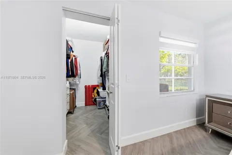 a view of a storage & utility room with a window