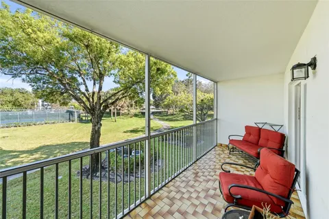 a balcony with chairs