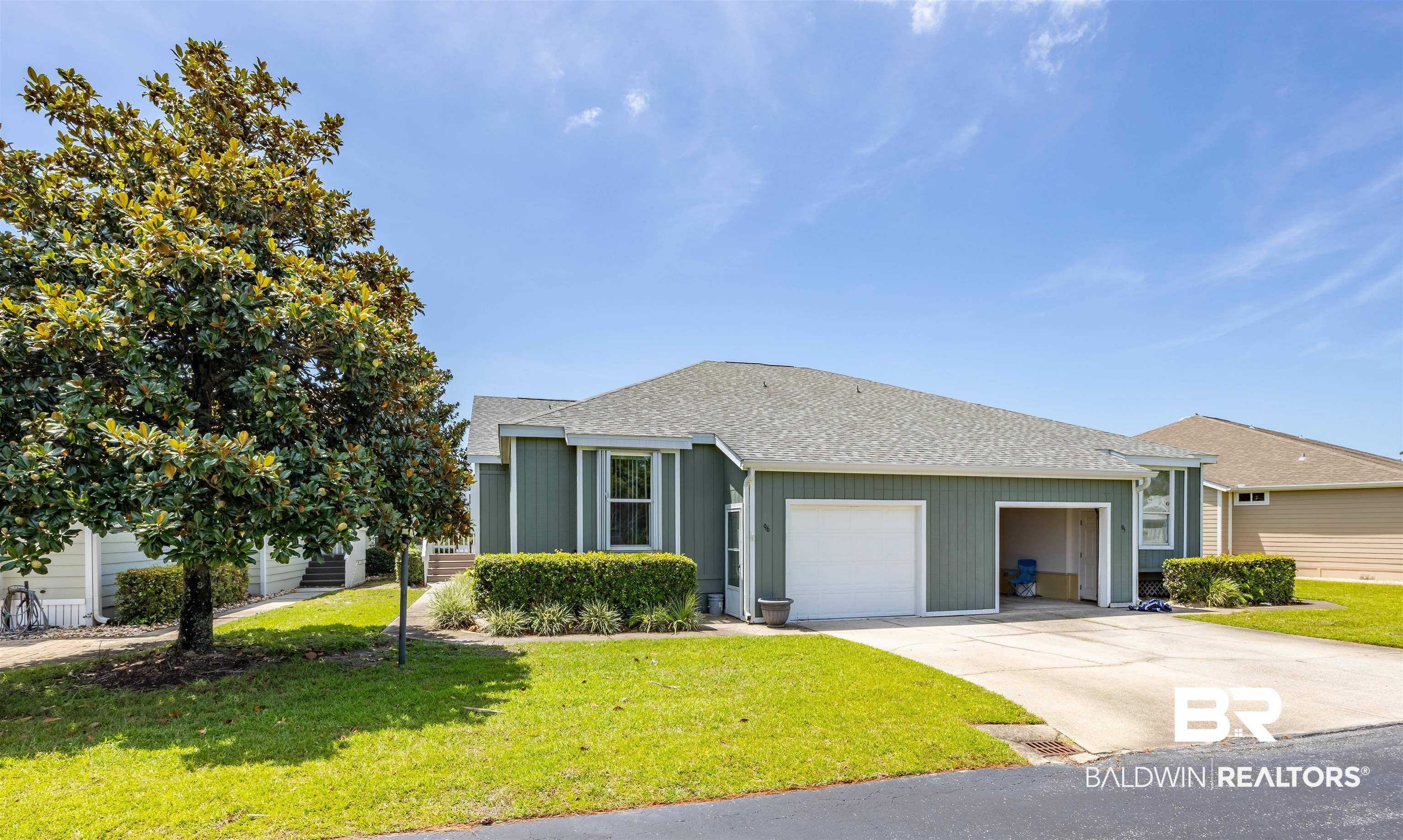 3200 Loop Road, Unit 96 Orange Beach, AL 36561 - Photo 3 of 49 Exterior featuring a split-level design with green siding and white trim
