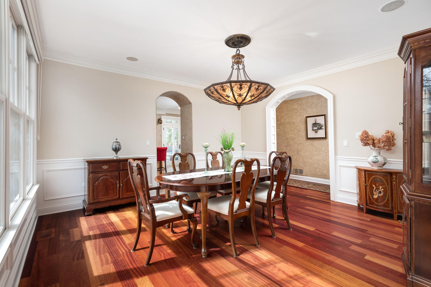 655 Sunset Drive Naperville, IL 60540 - Photo 13 of 61 a view of a dining room with furniture wooden floor and chandelier