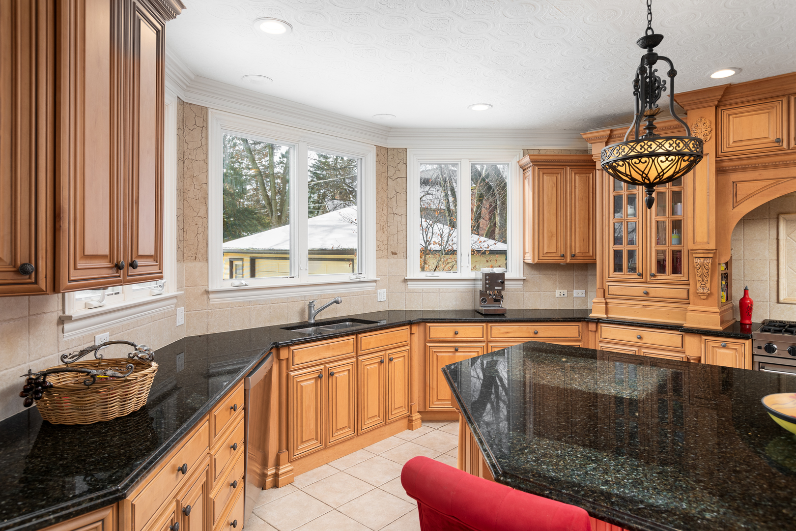 655 Sunset Drive Naperville, IL 60540 - Photo 18 of 61 a kitchen with granite countertop a stove and a sink