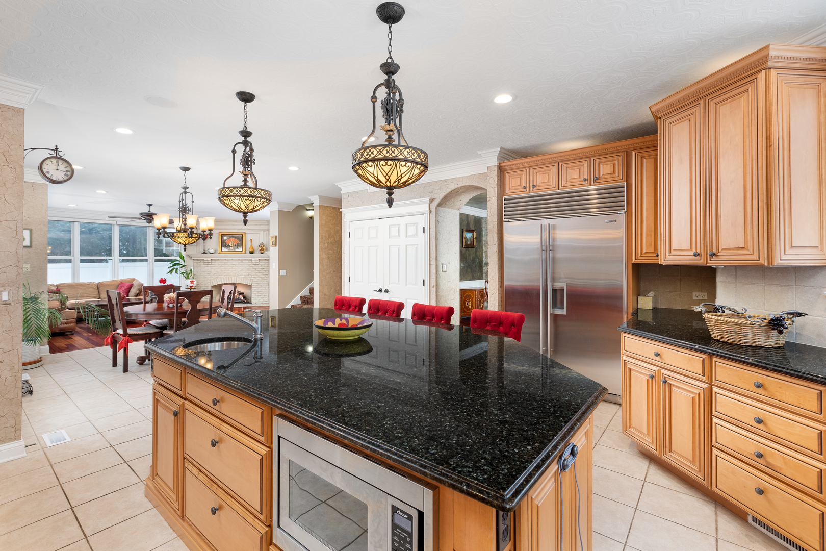 655 Sunset Drive Naperville, IL 60540 - Photo 19 of 61 a kitchen with stainless steel appliances granite countertop a sink a stove and a wooden cabinets
