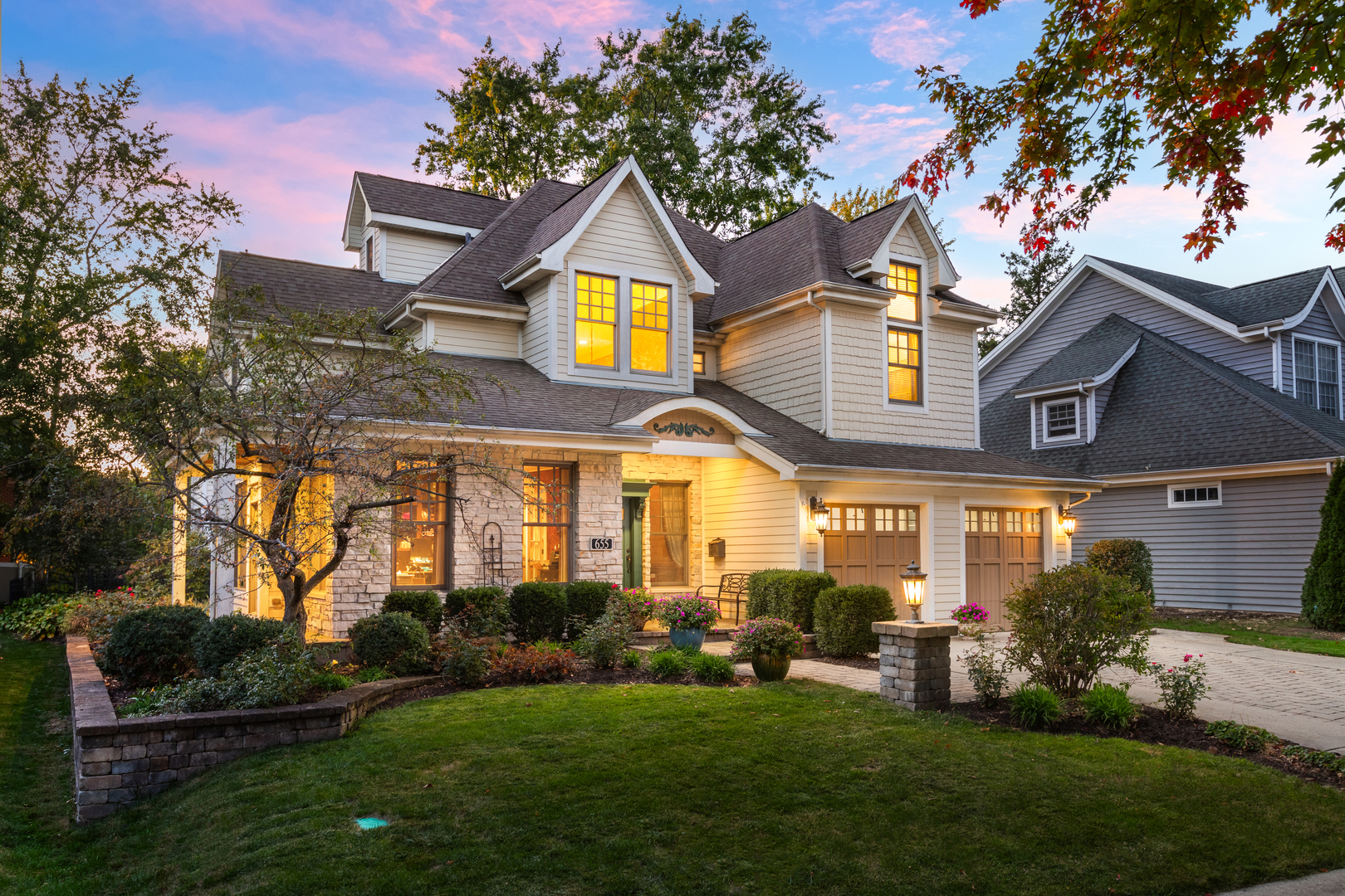 655 Sunset Drive Naperville, IL 60540 - Photo 2 of 61 a front view of a house with a garden and plants