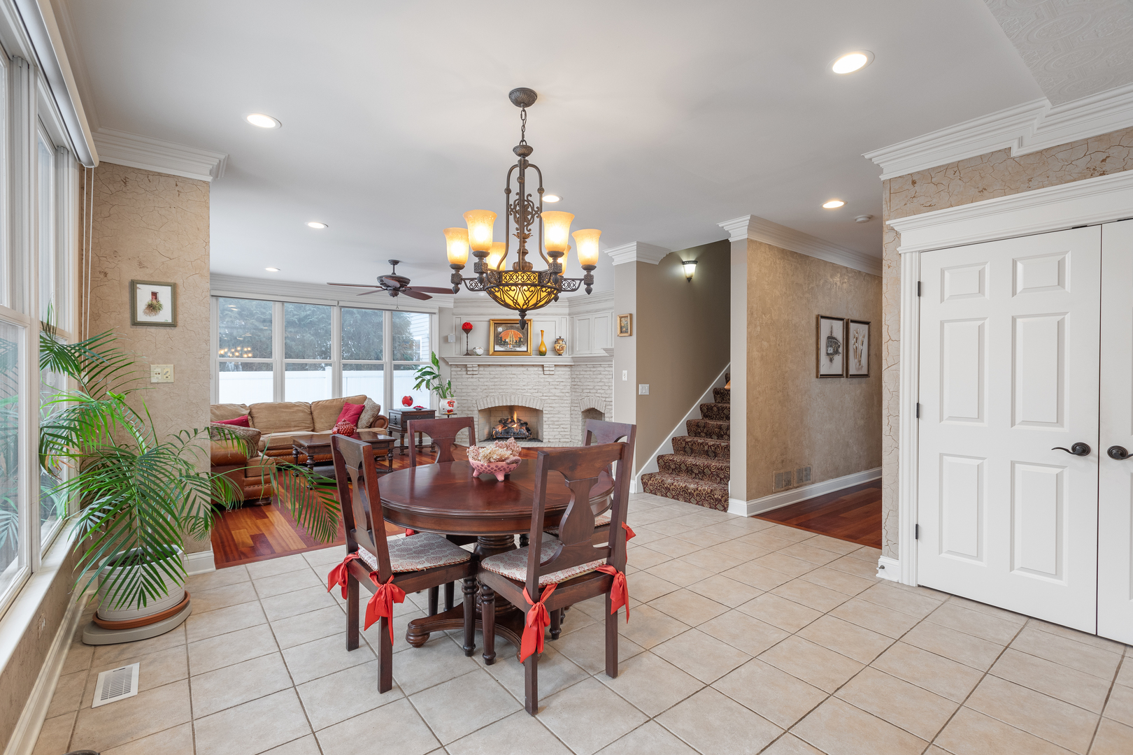 655 Sunset Drive Naperville, IL 60540 - Photo 24 of 61 a view of a dining room with furniture and chandelier