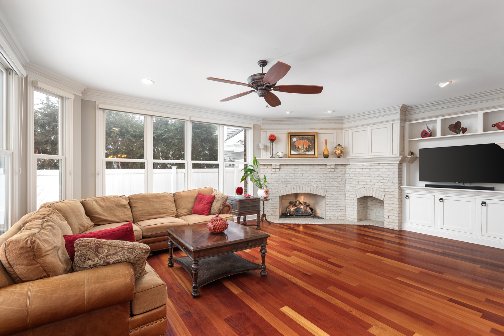 655 Sunset Drive Naperville, IL 60540 - Photo 25 of 61 a living room with furniture a flat screen tv and a fireplace