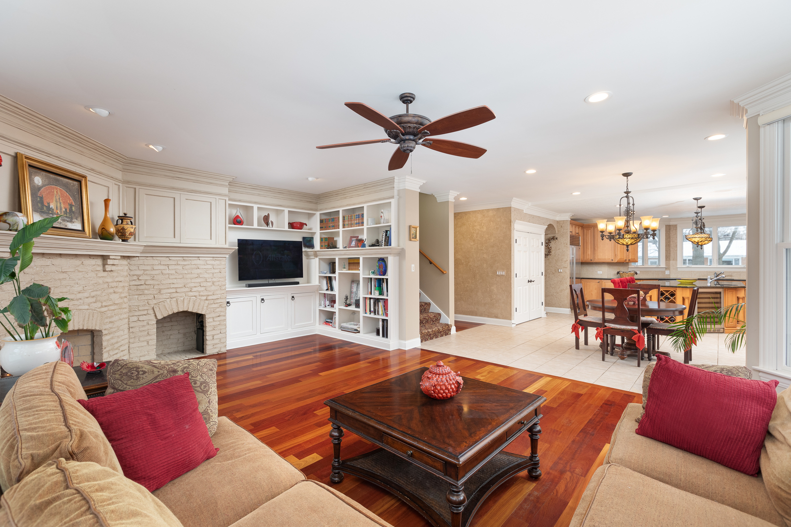655 Sunset Drive Naperville, IL 60540 - Photo 27 of 61 a living room with furniture a flat screen tv and a fireplace