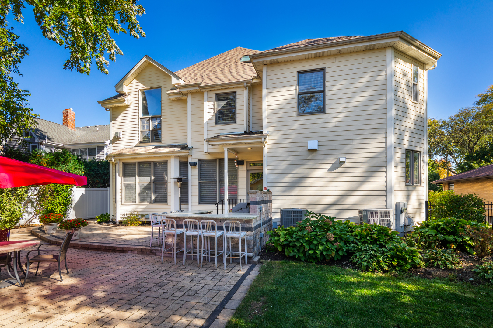 655 Sunset Drive Naperville, IL 60540 - Photo 49 of 61 a view of a house with a yard and sitting area
