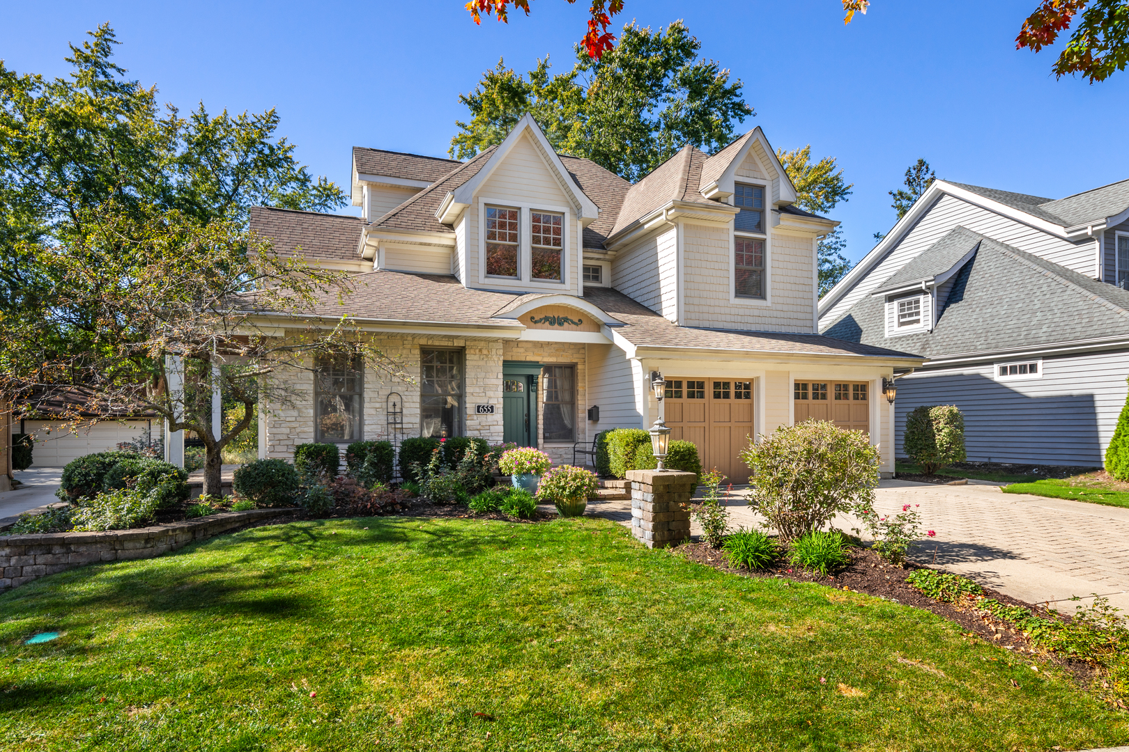 655 Sunset Drive Naperville, IL 60540 - Photo 57 of 61 front view of a house with a yard