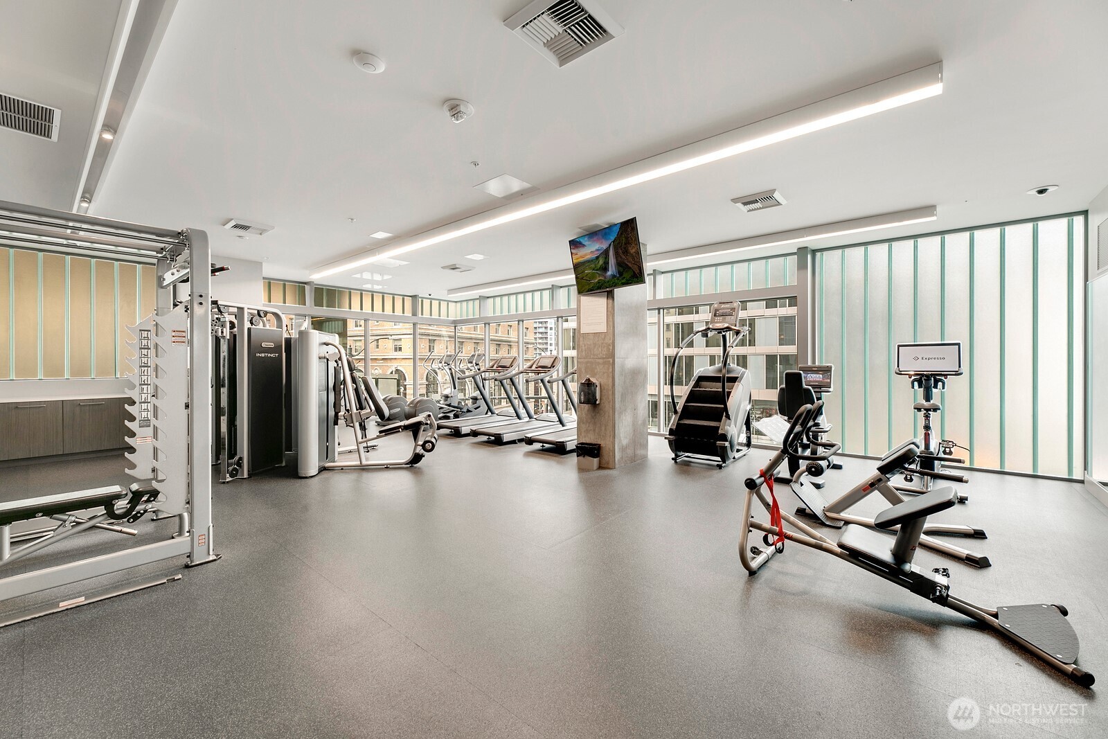 121 Stewart Street, Unit 1502 Seattle, WA 98101 - Photo 17 of 22 a view of a room with gym equipment