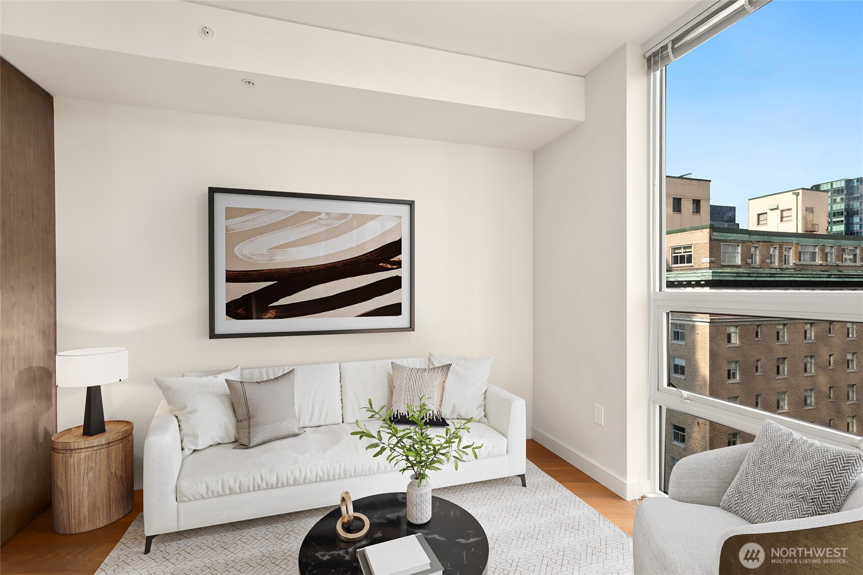 121 Stewart Street, Unit 1502 Seattle, WA 98101 - Photo 4 of 22 a living room with furniture and a large window