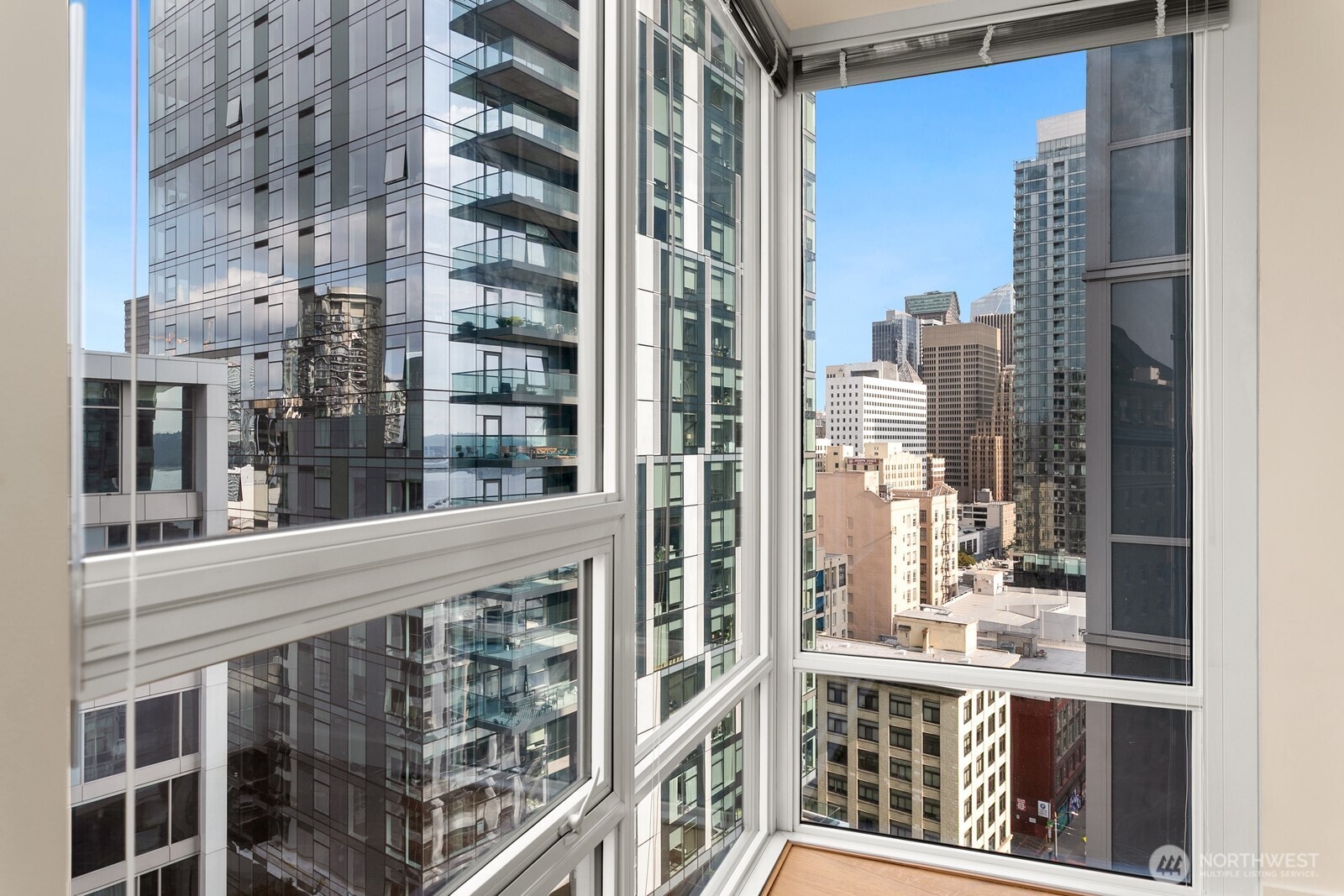 121 Stewart Street, Unit 1502 Seattle, WA 98101 - Photo 5 of 22 a view of a building from a balcony