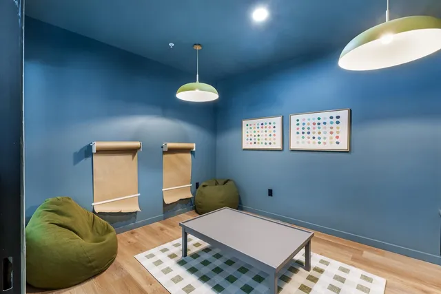 a bedroom with a bed and a lamp