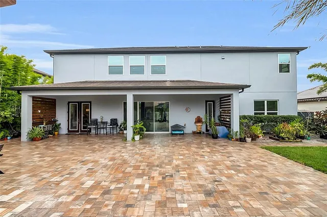 a front view of a house with a yard and porch