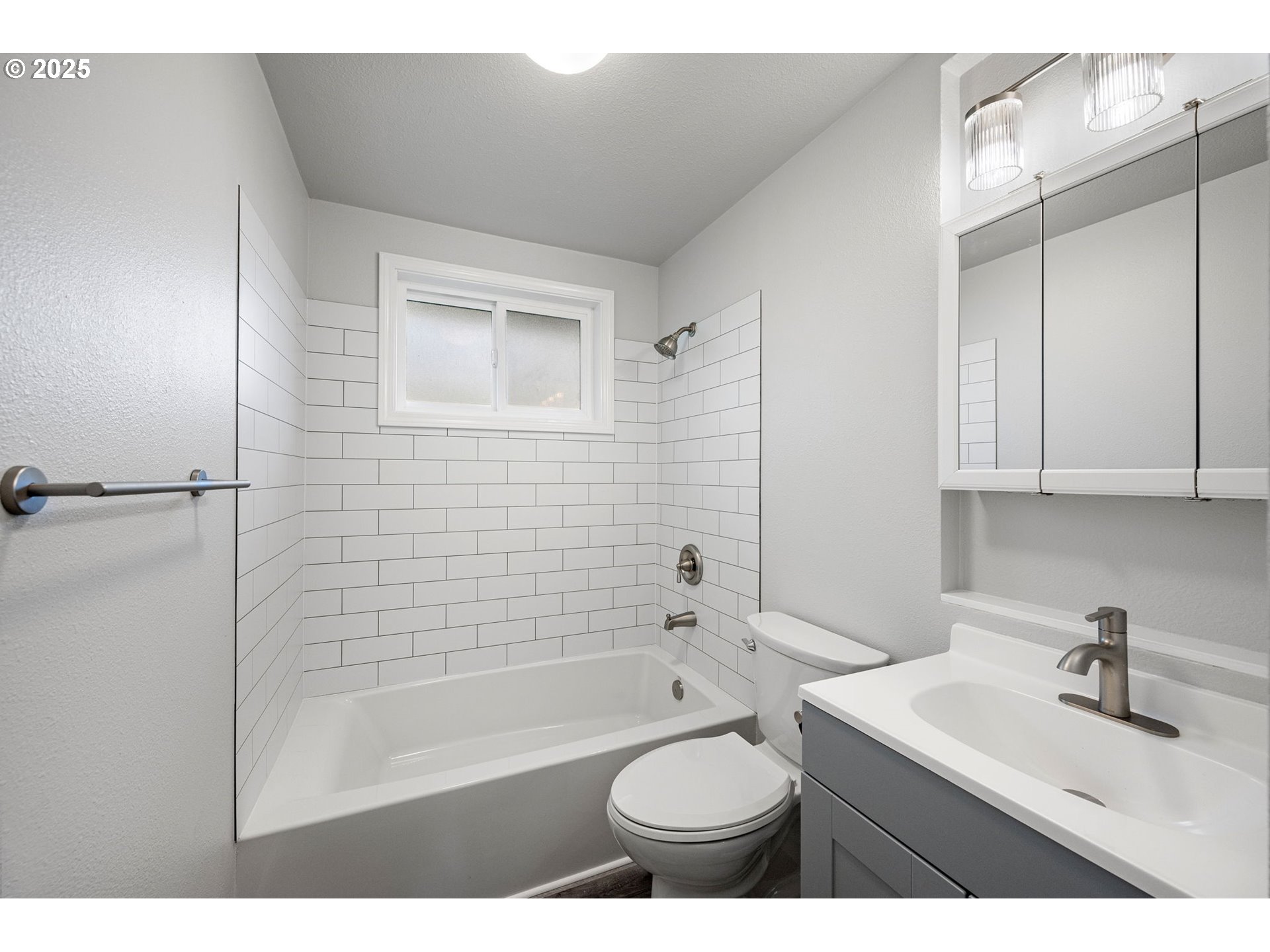 450 U Street Springfield, OR 97477 - Photo 11 of 25 a bathroom with a sink toilet a mirror and shower