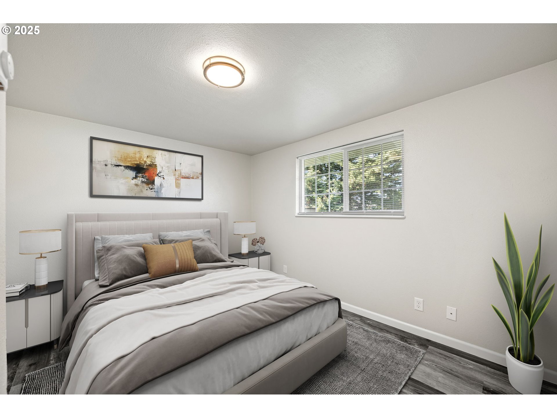450 U Street Springfield, OR 97477 - Photo 14 of 25 a bedroom with a large bed and a potted plant