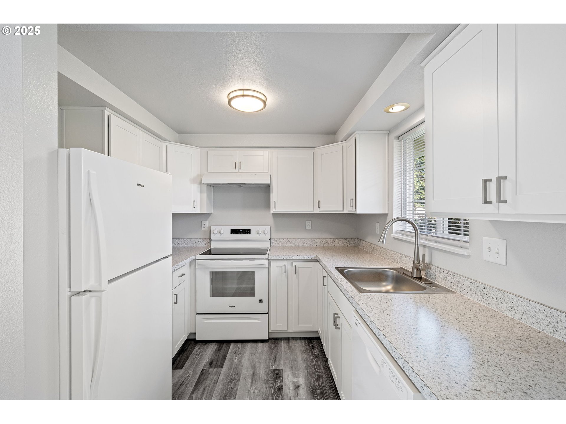 450 U Street Springfield, OR 97477 - Photo 19 of 25 a kitchen with a refrigerator a sink and cabinets