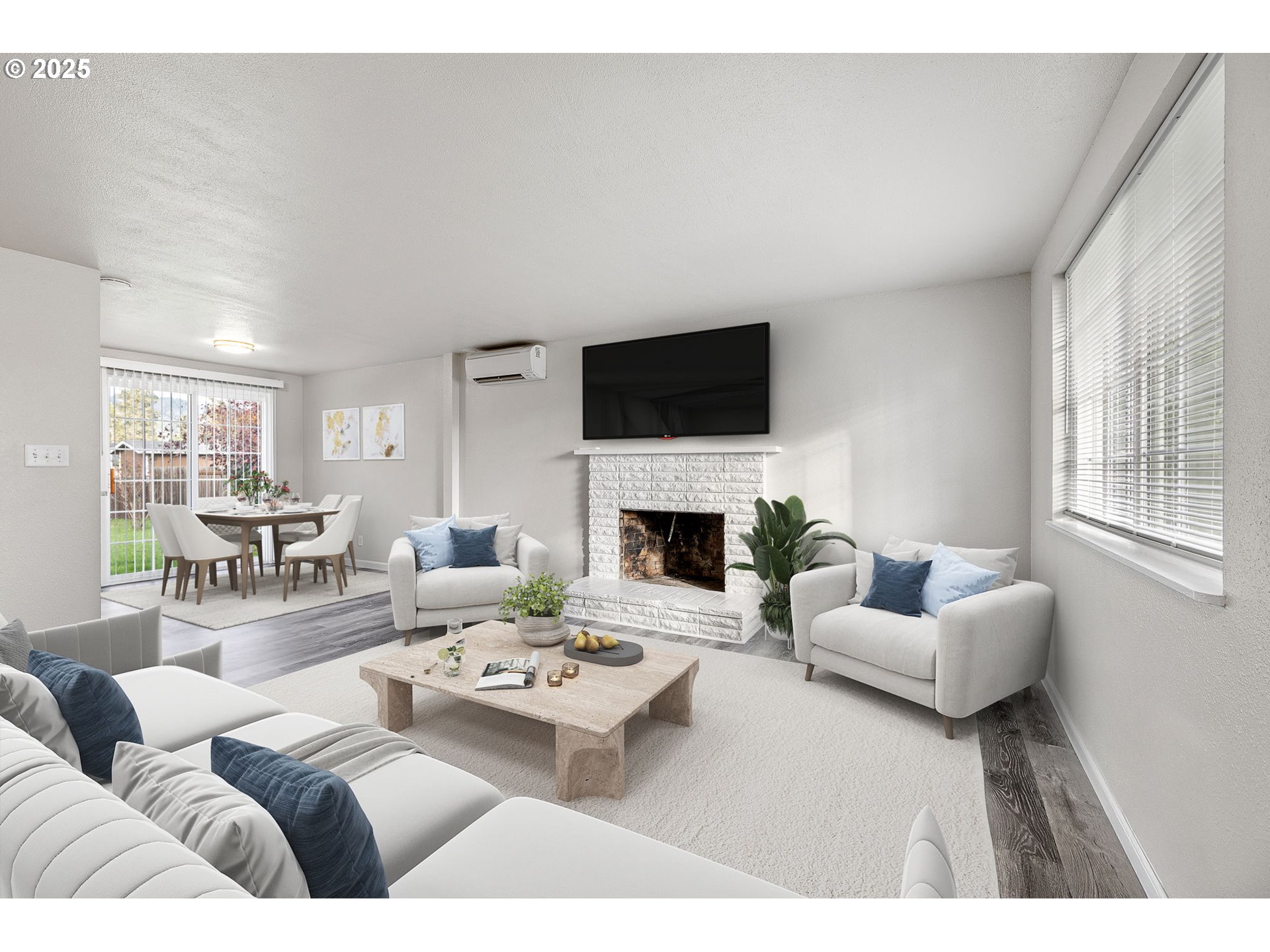 450 U Street Springfield, OR 97477 - Photo 5 of 25 a living room with furniture a fireplace and a flat screen tv