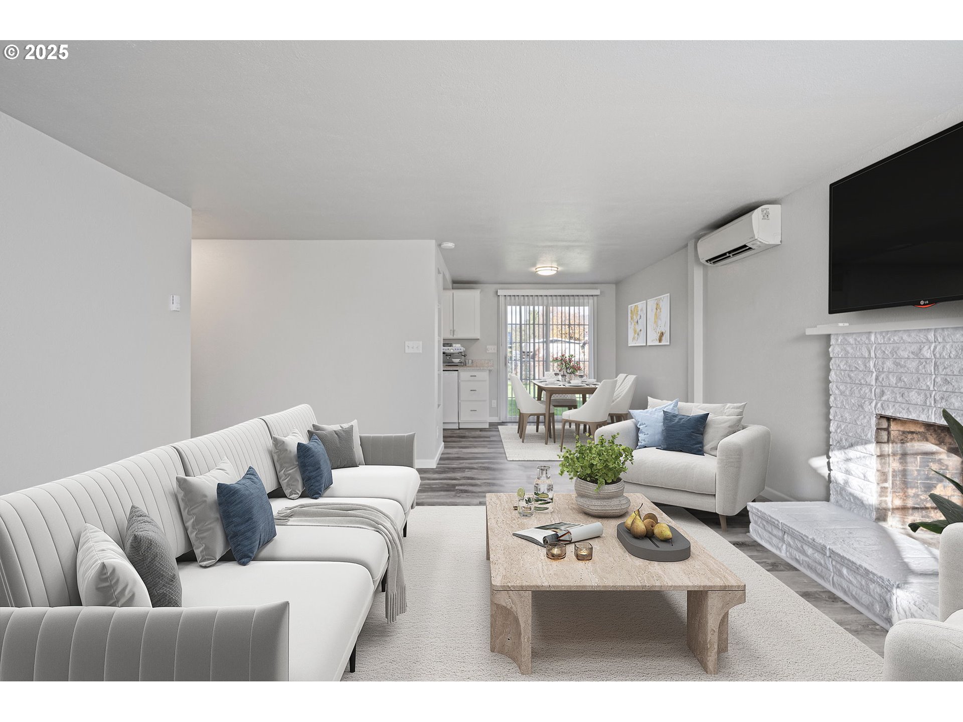 450 U Street Springfield, OR 97477 - Photo 6 of 25 a living room with furniture a flat screen tv and a fireplace