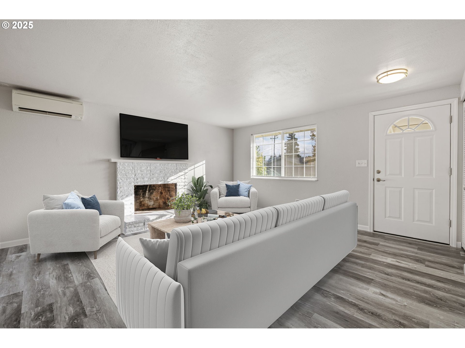 450 U Street Springfield, OR 97477 - Photo 8 of 25 a living room with furniture a fireplace and a flat screen tv