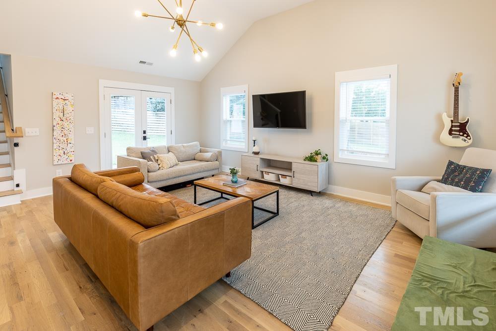 2200 Sheffield Road Raleigh, NC 27610 - Photo 12 of 44 a living room with furniture and a flat screen tv