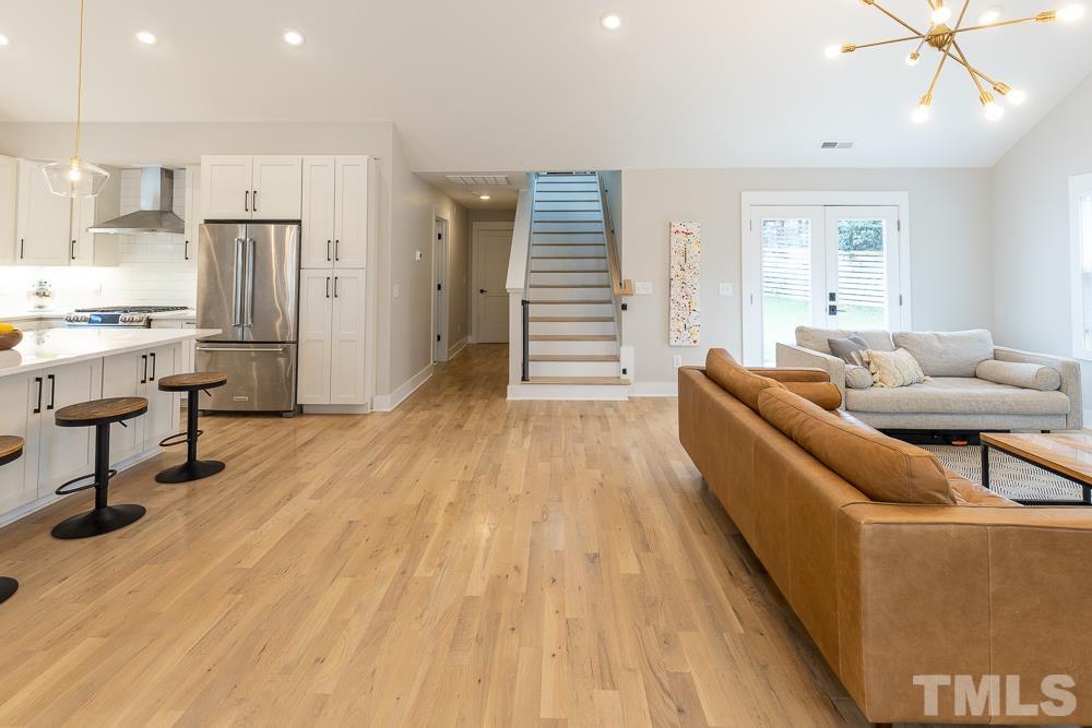 2200 Sheffield Road Raleigh, NC 27610 - Photo 16 of 44 a living room with furniture and a wooden floor