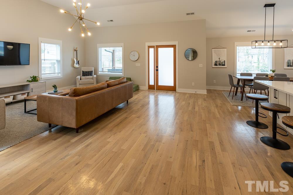 2200 Sheffield Road Raleigh, NC 27610 - Photo 18 of 44 a living room with furniture and a wooden floor