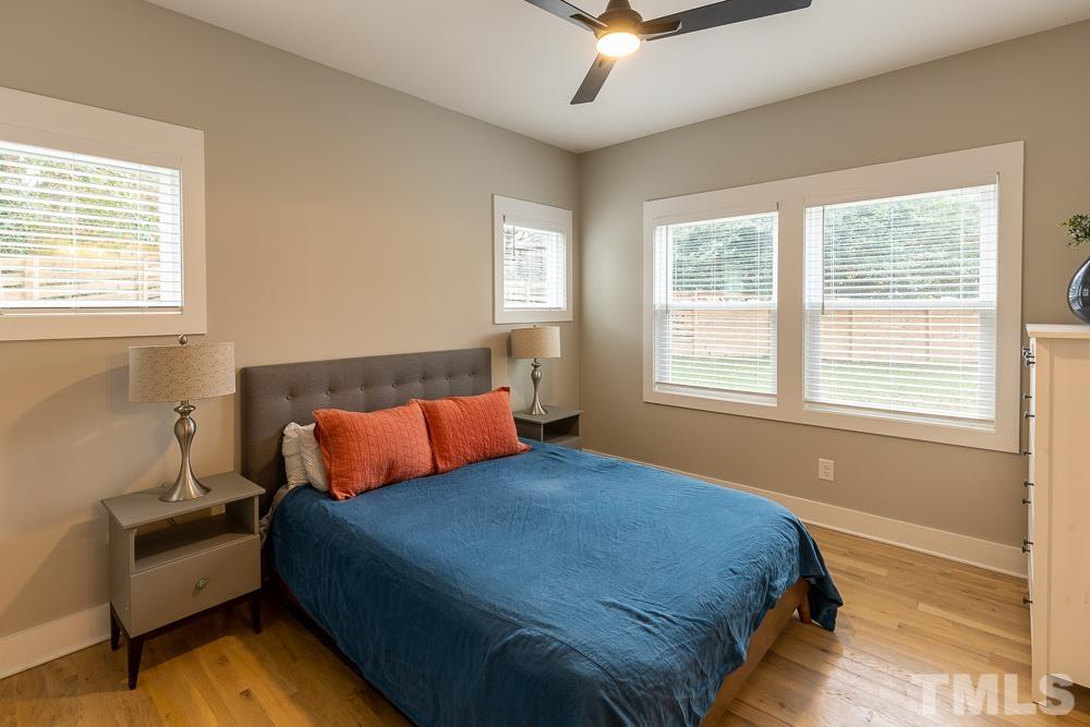 2200 Sheffield Road Raleigh, NC 27610 - Photo 24 of 44 a bedroom with a bed couch and window