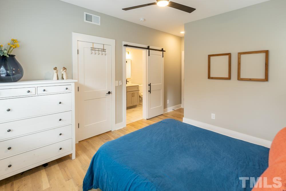 2200 Sheffield Road Raleigh, NC 27610 - Photo 26 of 44 a bedroom with a bed and a dresser