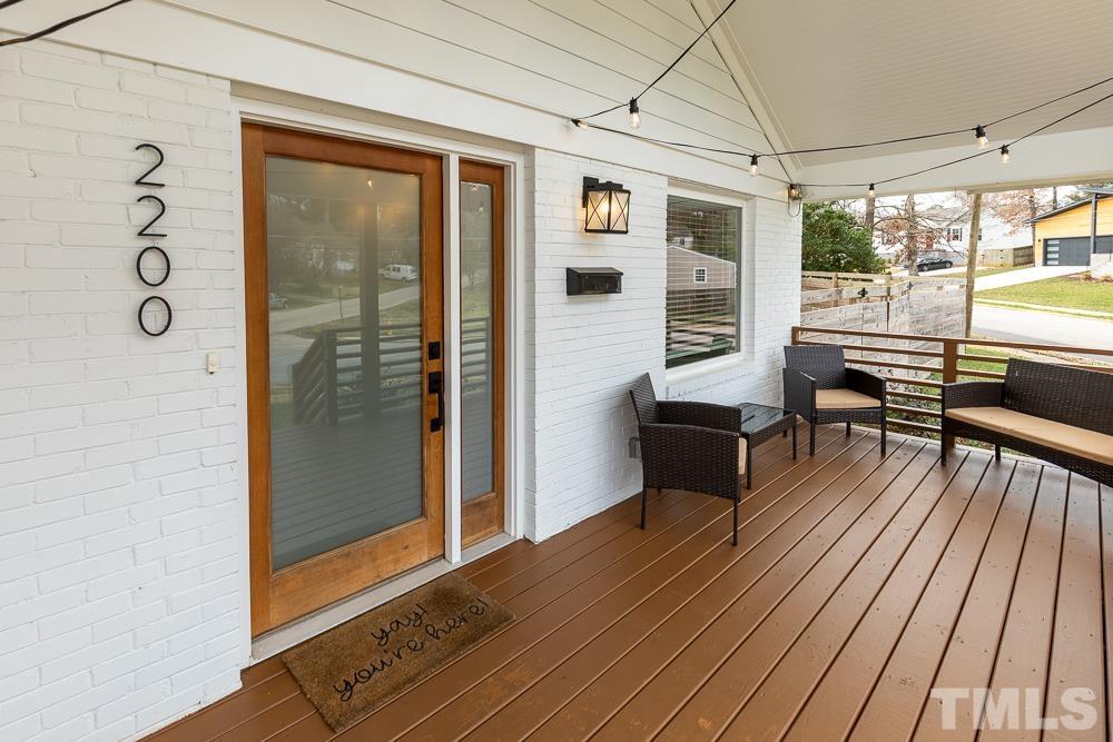 2200 Sheffield Road Raleigh, NC 27610 - Photo 3 of 44 a hallway with wooden floor and furniture
