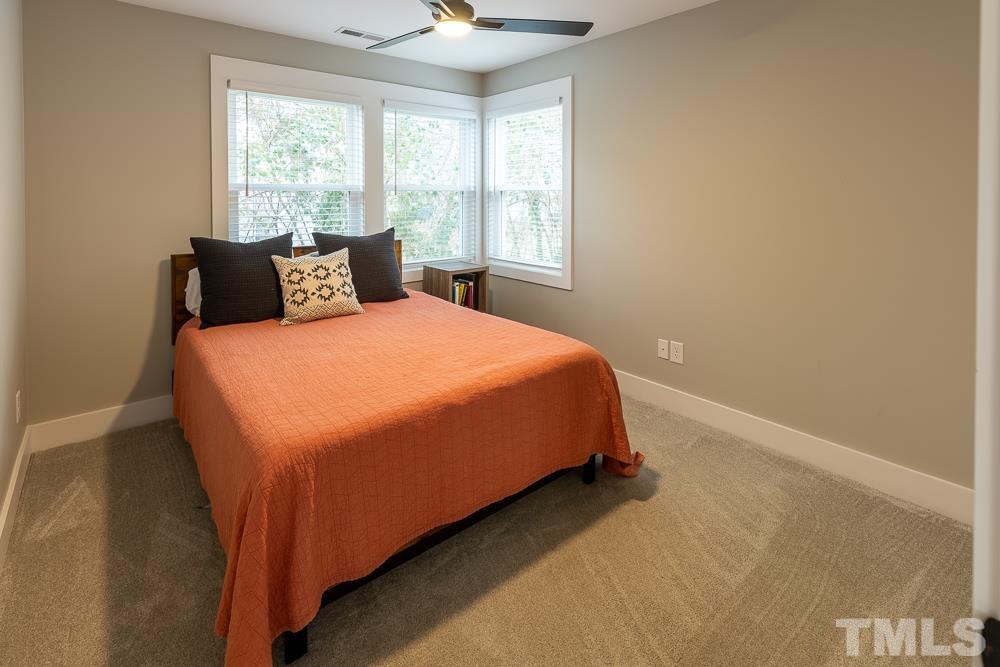 2200 Sheffield Road Raleigh, NC 27610 - Photo 31 of 44 a bedroom with a bed and window