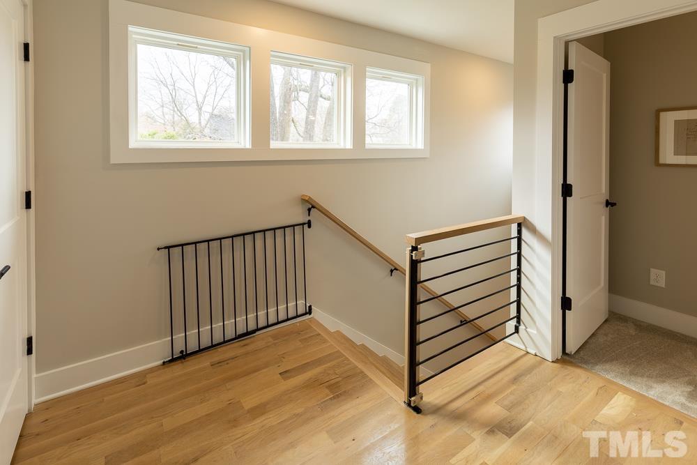 2200 Sheffield Road Raleigh, NC 27610 - Photo 33 of 44 a view of a hallway with wooden floor and entryway
