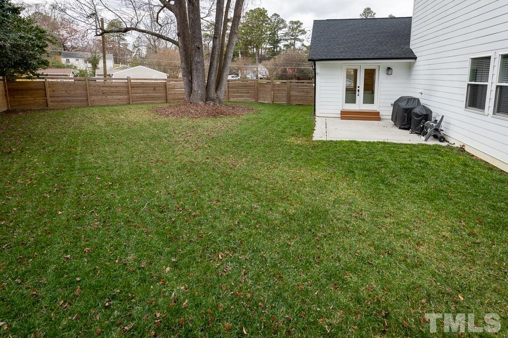 2200 Sheffield Road Raleigh, NC 27610 - Photo 37 of 44 a view of a house with a backyard