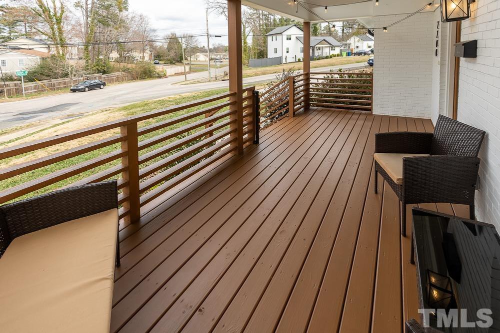 2200 Sheffield Road Raleigh, NC 27610 - Photo 4 of 44 a view of a balcony with wooden floor