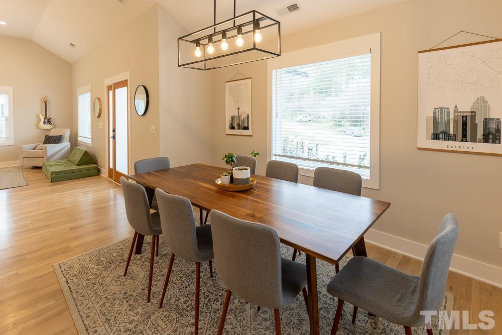 2200 Sheffield Road Raleigh, NC 27610 - Photo 10 of 44 a view of a dining room with furniture window and wooden floor