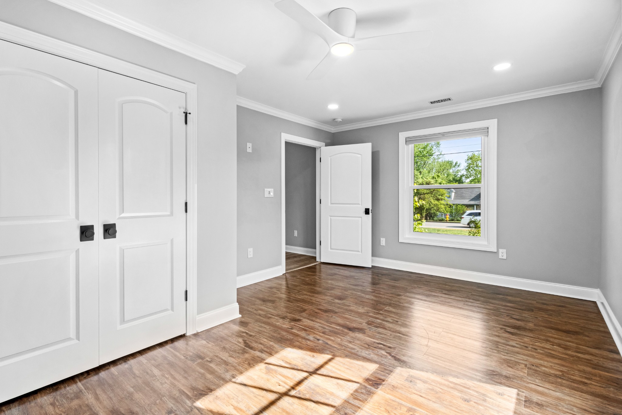 209 Hawkins Road Clarksville, TN 37040 - Photo 27 of 39 a view of an empty room with window and wooden floor