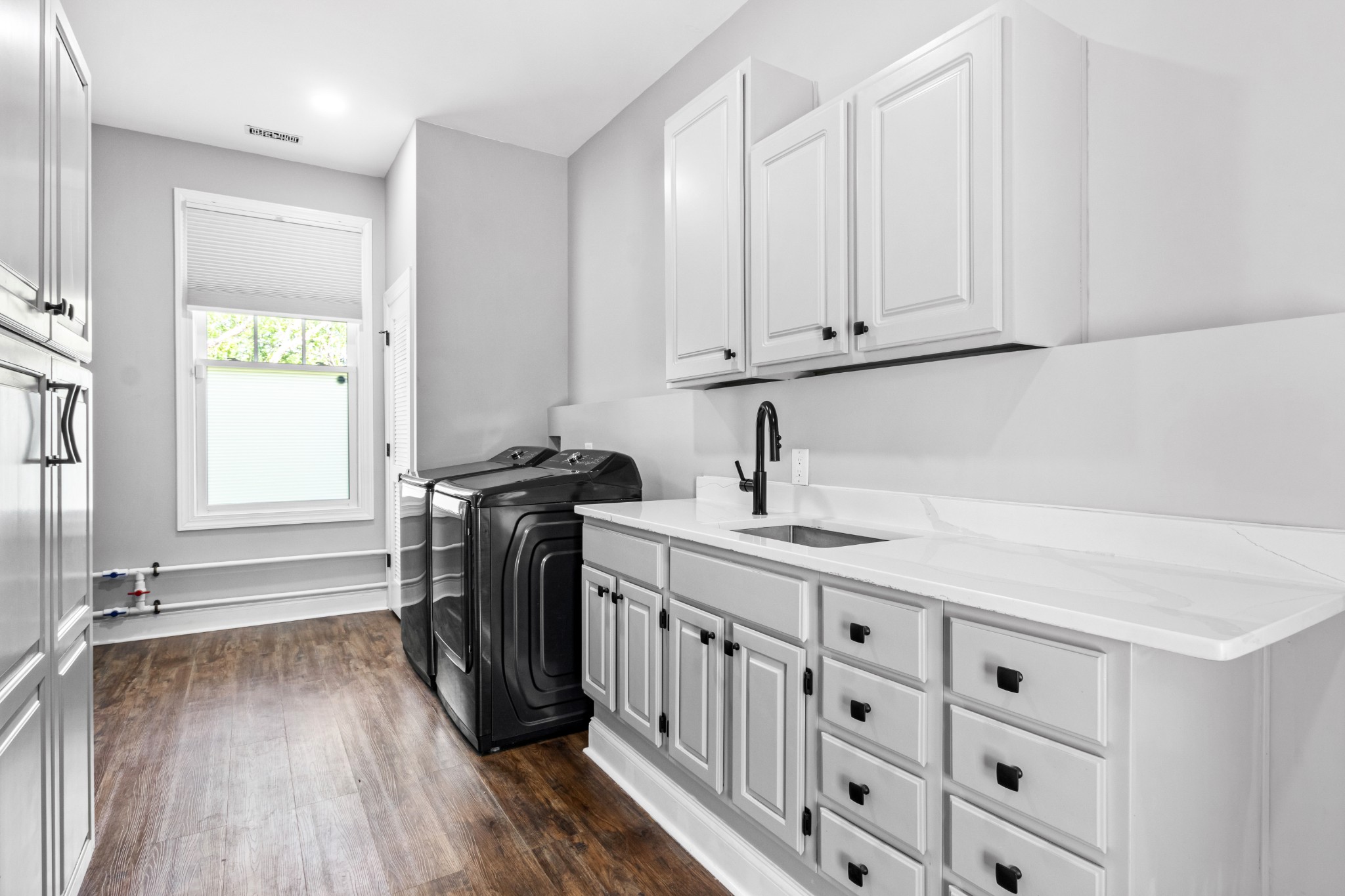 209 Hawkins Road Clarksville, TN 37040 - Photo 32 of 39 a kitchen with stainless steel appliances a white stove top oven cabinets and a wooden floor