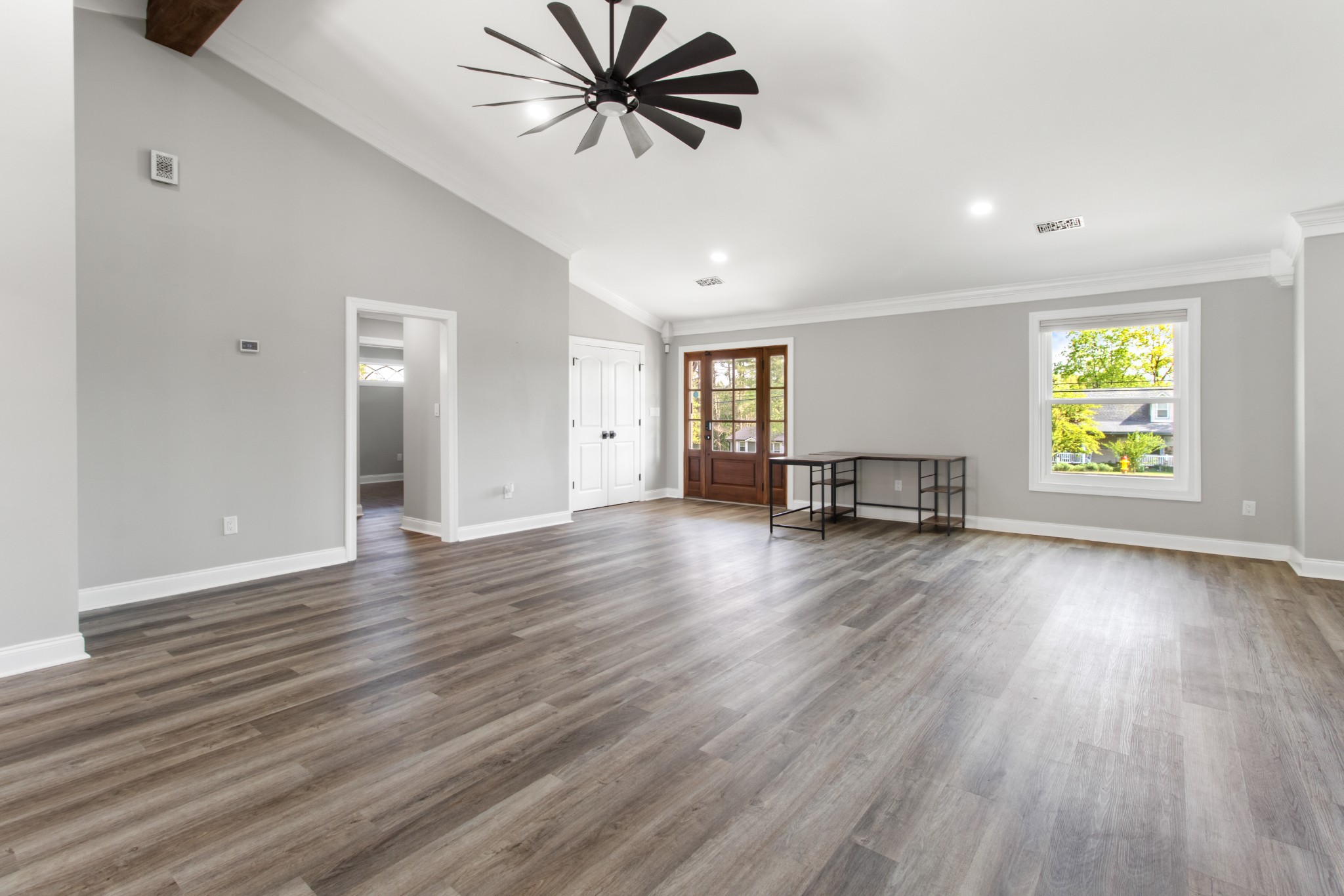 209 Hawkins Road Clarksville, TN 37040 - Photo 5 of 39 an empty room with wooden floor and windows