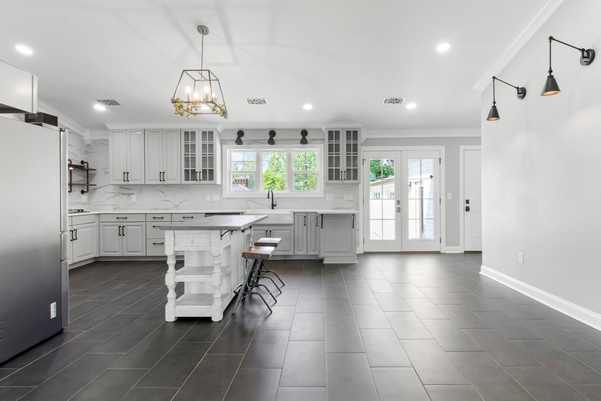 209 Hawkins Road Clarksville, TN 37040 - Photo 9 of 39 a large white kitchen with a large window appliances and cabinets