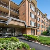 a view of a building with sitting area